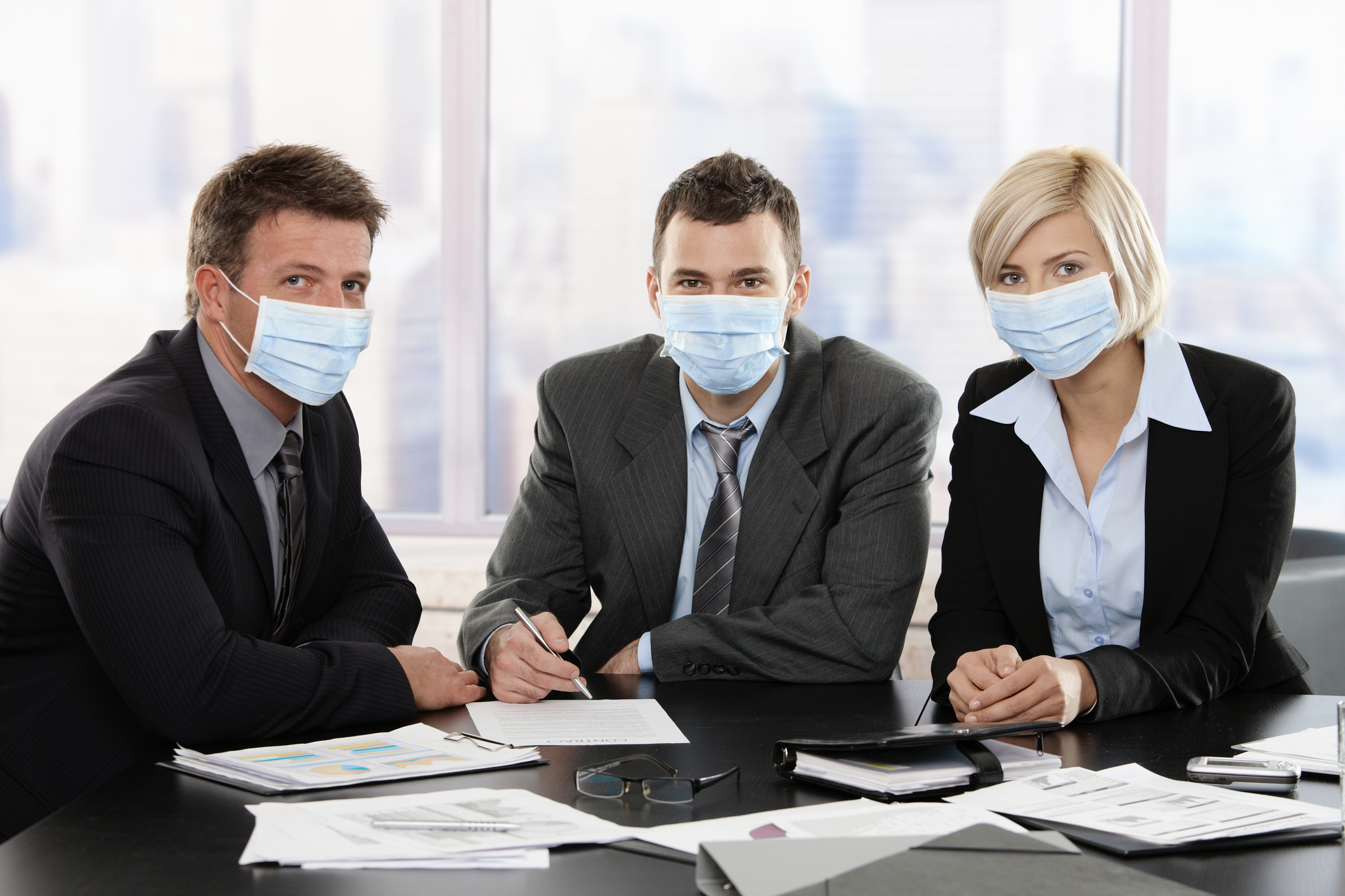 Business people fearing swineflu virus