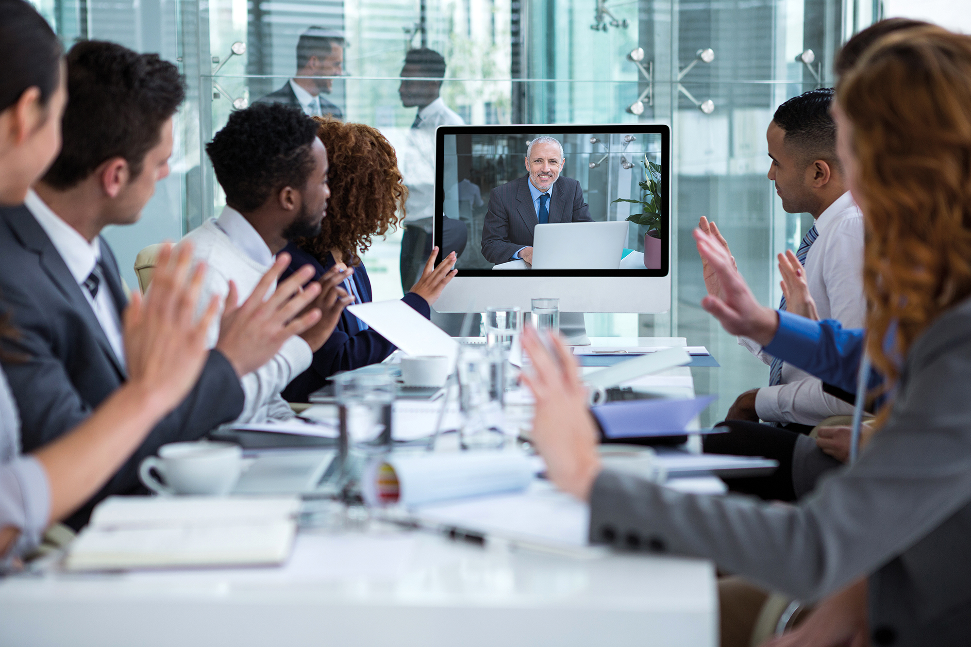 Business people looking at a screen during a video conference